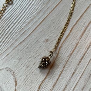 Anthropologie gold pinecone necklace